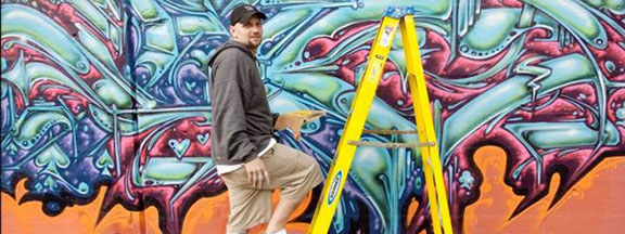 Detroit Artist creating a Mural
