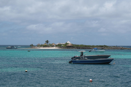 Caribbean beach boats in water