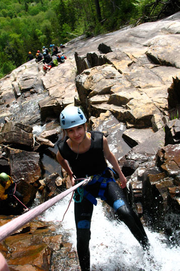 Quebec's Active Lifestyle woman down waterfall 1