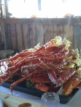 Just-steamed king crab legs in a fjordside fishing shack
