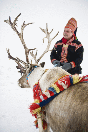 Sami man with reindeer Finnmark Photo Courtesy: www.visitnorway.com
