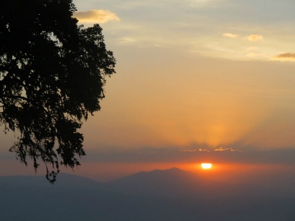 Sunset over the Ngorongoro Crater in Tanzania featured on TravelSquire