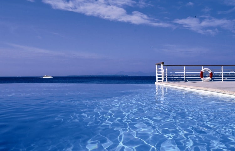 Infinity Pool at Hotel du Cap Eden Roc featured on TravelSquire's virtual happy hour