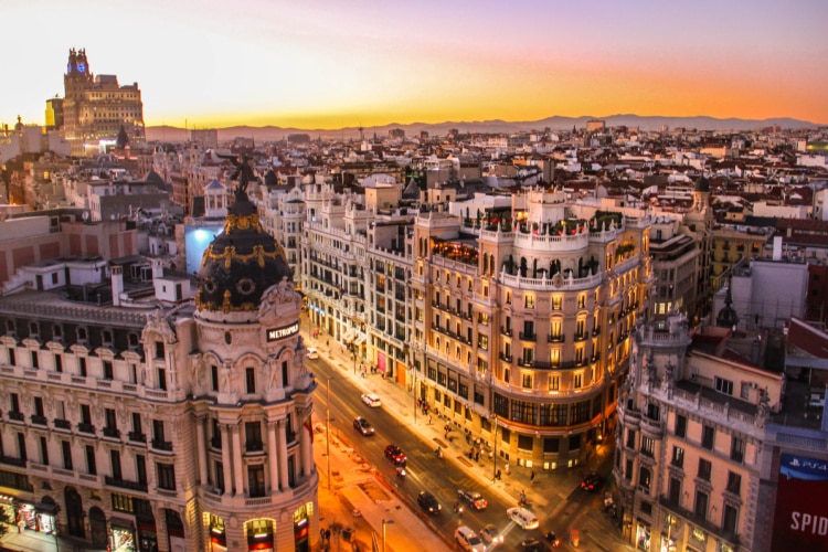 Sunset view of Grand Via in Mardrid Spain highlights